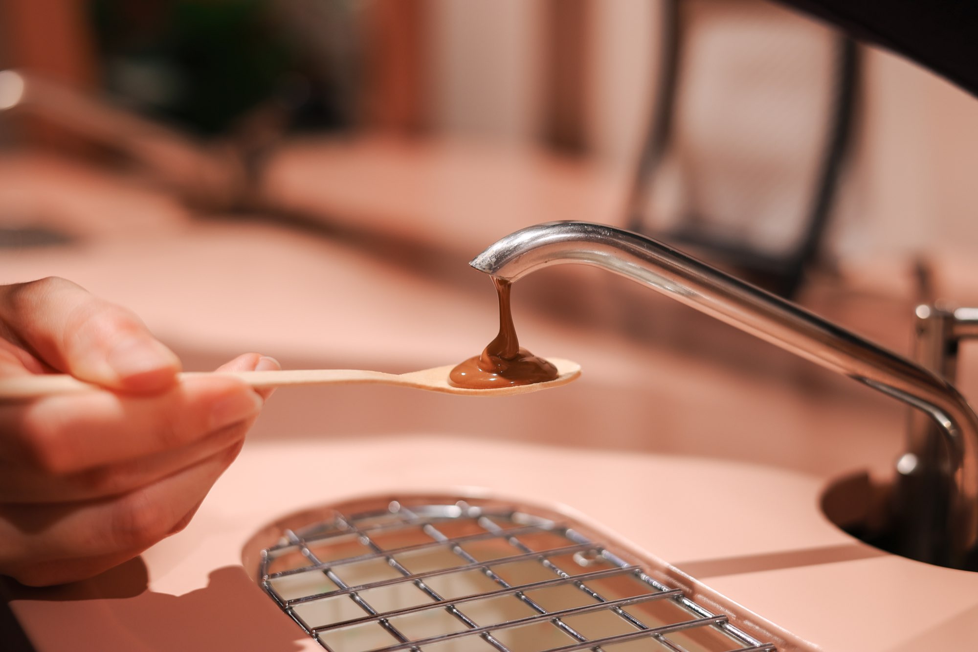 Liquid chocolate tasting from a tap at Chocolate Museum Zagreb
