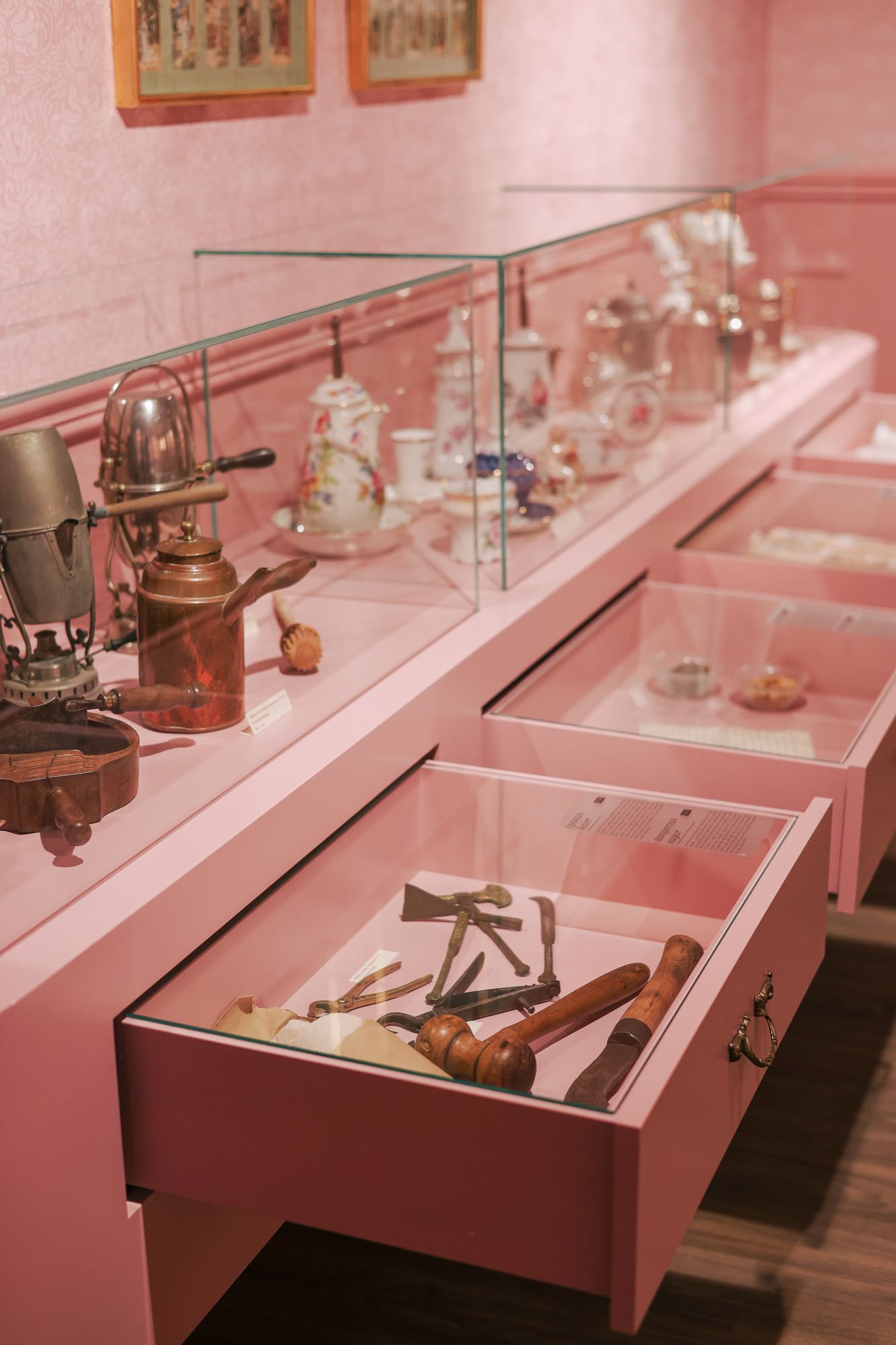 Exhibition drawers with historic chocolate-making tools at Chocolate Museum Zagreb